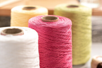 Threads in reels. Colored bobbins for embroidery knitting hobby accessories creativity.