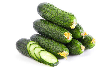 Fresh vegetables: green cucumbers whole and sliced isolated on white background macro close up. 