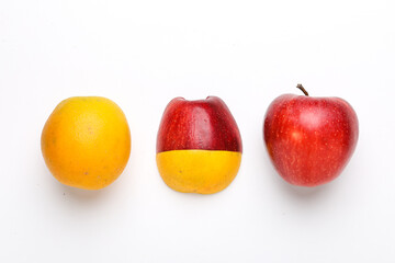 Stack of fresh fruits citrus slices, apple, orange or lemon. Colorful healthy fitness creative fun food concept. Mixed citrus fruit, apple isolated on white background