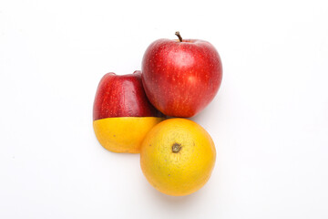 Stack of fresh fruits citrus slices, apple, orange or lemon. Colorful healthy fitness creative fun food concept. Mixed citrus fruit, apple isolated on white background