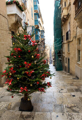 Fototapeta na wymiar Valletta, Malta - Ursula street decorated for Christmas in Valletta, Malta