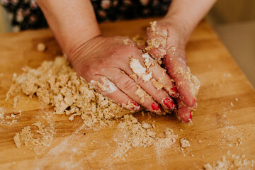 woman hands kneading dough, christmas cookies recipe , homemade bakery concept
