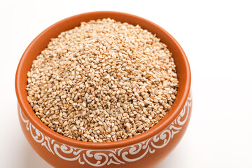 Sesame seed in bowl on white background