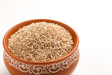 Sesame seed in bowl on white background