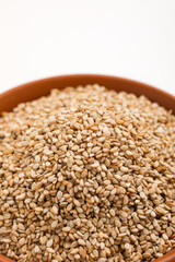 Sesame seed in bowl on white background