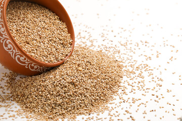 Sesame seed in bowl on white background