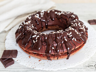 Cake. Typical Austrian chocolate cake, consisting of two thick plates of chocolate sponge cake, separated by a thin layer of apricot jam. Vegan cake