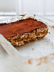 Italian tiramisu dessert on a porcelain plate. Vegan dessert