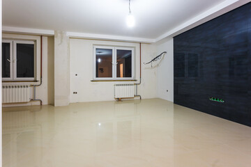 Empty unfurnished room with minimal preparatory repairs. interior with white walls