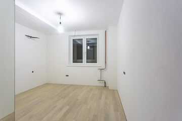 Empty unfurnished room with minimal preparatory repairs. interior with white walls