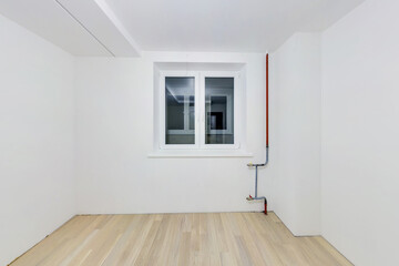 Empty unfurnished room with minimal preparatory repairs. interior with white walls