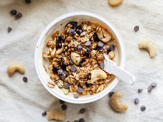 Yogurt with cereals, cashews and chocolate. Pack to take away
