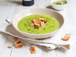 Zucchini and potato soup with bread croutons