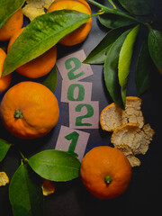 Mandarines and leaves, 2021 New year bachground or christmas card