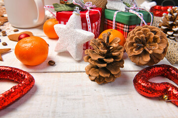 sweet food top view background for merry christmas or new year holiday decoration - chocolate candies, tangerines, cookies on white wood