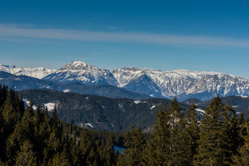 beautiful high mountains with snow and blue sky while hiking