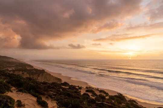 beautiful sunset with beach and sand dunes on the Alentejo coast of Portugal
