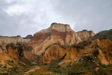 bizarre colorful eroded sand dunes on the Alentejo coast of Portugal