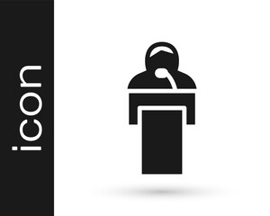 Black Gives lecture icon isolated on white background. Stand near podium. Speak into microphone. The speaker lectures and gestures. Vector.