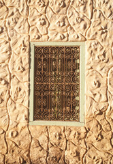 One window with metal bars in the wall.