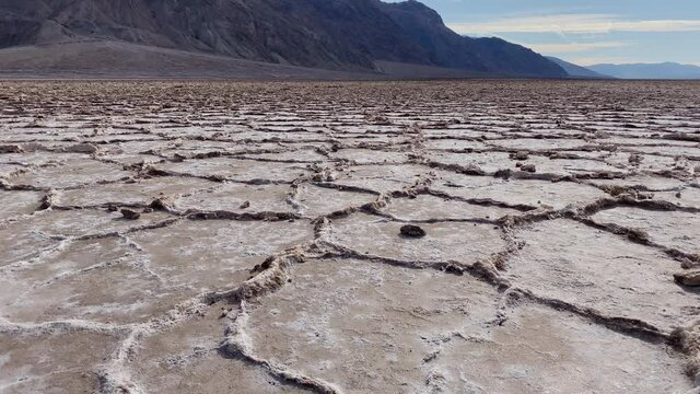 Rings of crusted ground with salt at Badwater basin at Death Valley National Park, CA, USA. Slider right to left.