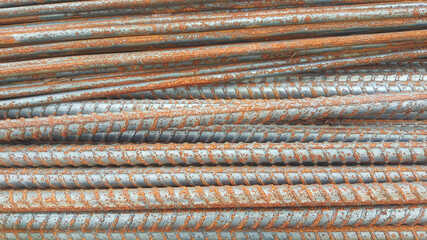 Stack of rusty iron rods or bars, 
rusty iron texture
