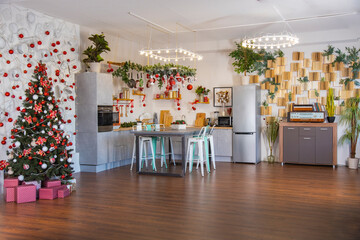 interior of a cozy modern spacious kitchen for a large family, decorated for the New Year celebration