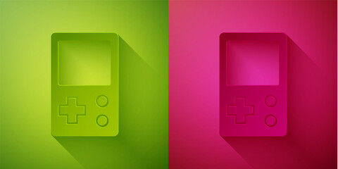 Paper cut Portable tetris electronic game icon isolated on green and pink background. Vintage style pocket brick game. Interactive playing device. Paper art style. Vector.