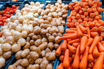 Shelves with vegetables in a grocery store