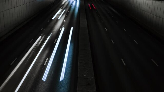 4K timelapse of night traffic jam at Moscow, Russia. Rush hour. Entering and exiting the tunnel