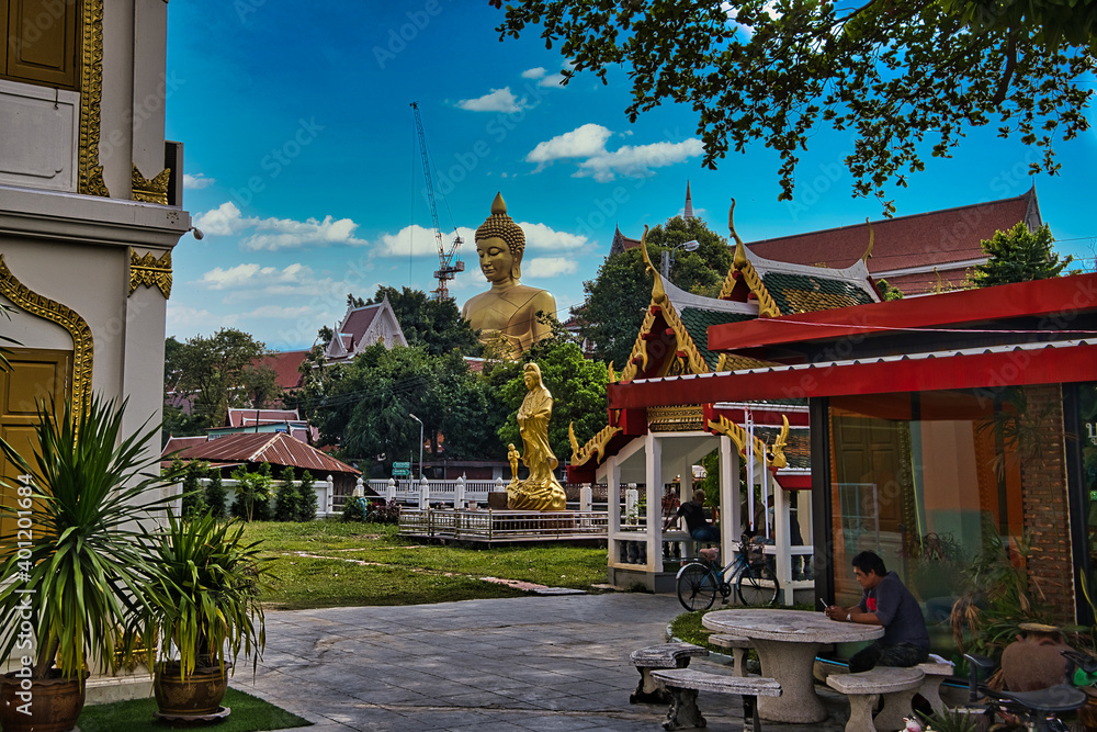 Wall mural golden buddha statue in bangkok thailand located along the river