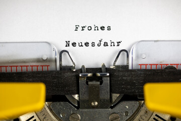 Frohe neues jahr (Happy New Year) written on an old typewriter