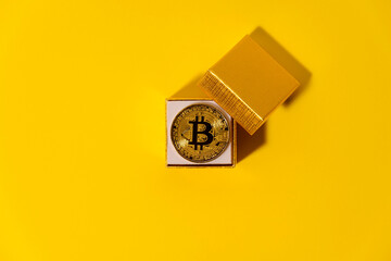 Bitcoin in the box on the yellow background.