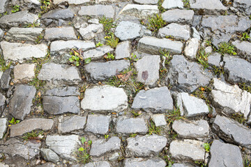 Texture and background of old stone sidewalk close up