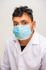 Portrait of young asian man wearing face protective medical mask for protection from virus disease