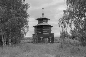 view of the old wooden houses in the park of Russian art in Kostroma, photo was taken on a cloudy summer day