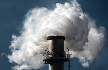 Factory smoke pipe sending smoke to the atmosphere. - obrazy, fototapety, plakaty