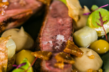 Duck breast with cauliflower puree and vegetables. The food in the restaurant. Food styling and restaurant meal serving.