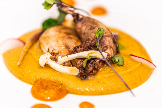 Duck thigh with mushrooms and sweet potato puree. The food in the restaurant. Food styling and restaurant meal serving.