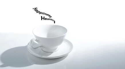 White empty teacup with light and shadow on a white table with message happiness and healthy over it