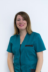 Female doctor posing in a dentist office