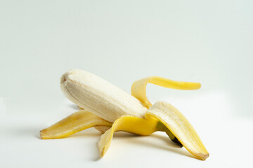 Close up open yellow banana isolated on white background