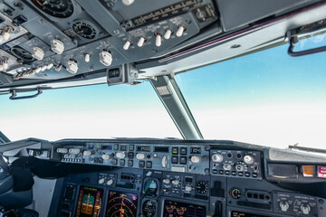 modern passenger airplane cockpit with blue sky in front 