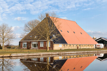 Farmhouse and canal in Hindeloopen, Netherlands, Europe