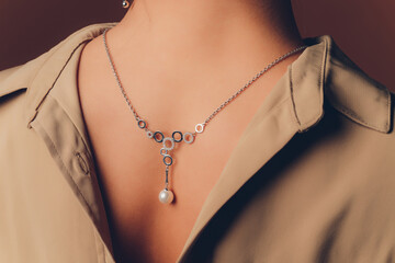 close up of boho styled woman hands with silver jewelry.