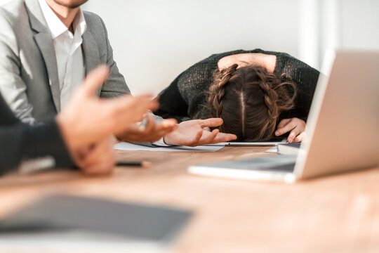 tired young businesswoman fell asleep during a group meeting