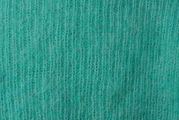 light green fabric texture from a piece of wool sweater