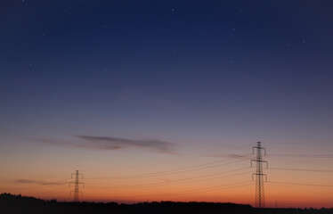 Fototapeta premium Power lines at sunset