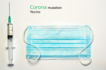 Medical blue white facemask with vaccine needle on a empty copy space background