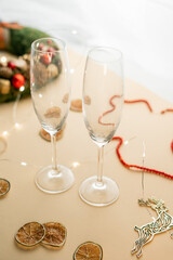 view of  empty champagne glass isolated on beige, Christmas mood